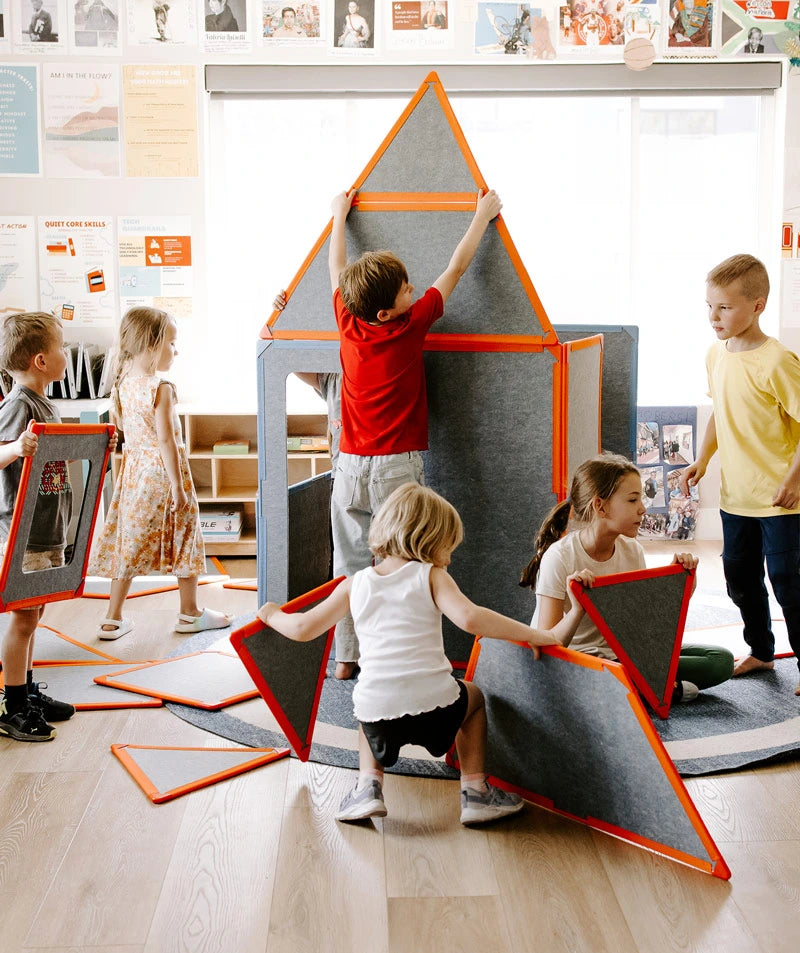 color:shared | Neighborhood Bundle hero, kids building a giant magnetic tile fort together in a classroom